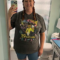 TheFirstLifestyle 37 Customer mirror selfie wearing an oversized charcoal Powerline World Tour '95 concert style tee