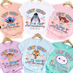 Personalized Disney Trip Most Likely To Family Vacation Tees 11 Personalized Disney Trip Most Likely To Family Vacation Tees in pastel colors group flat lay with glitter hangers