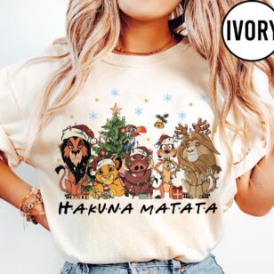 comfort colors lion king christmas shirt in blue jean styled as oversized holiday tee with simba holiday lights graphic for animal kingdom