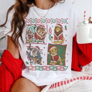 90s simba holiday tee in white layered with chunky red knit cardigan and christmas mug for cozy theme park morning outfit