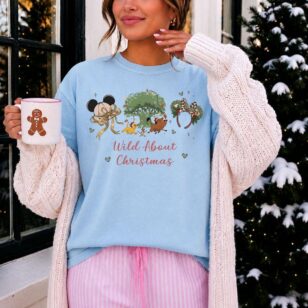 wild about christmas animal kingdom shirt in chambray blue layered with chunky cardigan for chilly florida evening park hopping