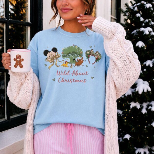 wild about christmas animal kingdom shirt in chambray blue layered with chunky cardigan for chilly florida evening park hopping