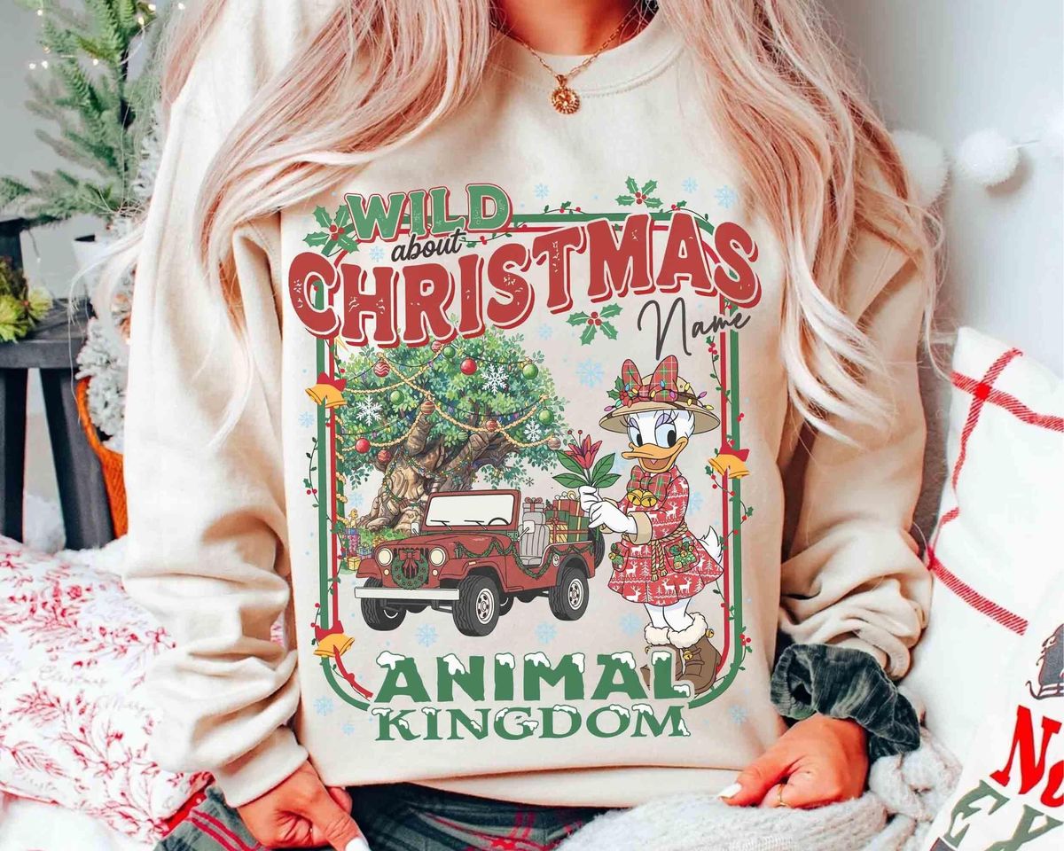 Custom safari jeep christmas sweatshirt graphic art showing red safari vehicle with holiday tree and Disney characters in front of Tree of Life