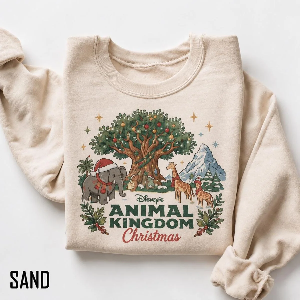 Vintage Animal Kingdom Christmas Sweatshirt For Cozy Park Days, Storybook Art 1 Vintage animal kingdom christmas sweatshirt in sand color featuring watercolor storybook elephant and Tree of Life
