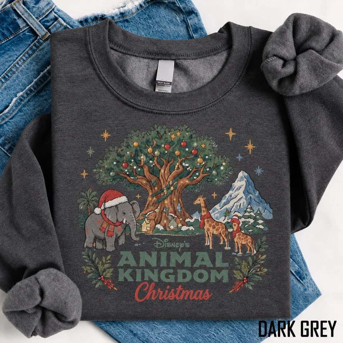 Vintage Animal Kingdom Christmas Sweatshirt For Cozy Park Days, Storybook Art 4 Close up watercolor artwork on elephant holiday shirt showing baby elephant and giraffe wearing winter scarves