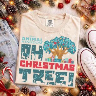 Flat lay of animal kingdom oh christmas tree shirt in sand cotton with holiday pine garland and vintage sneakers