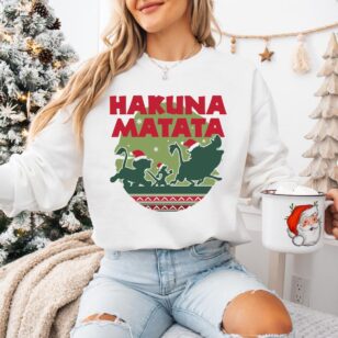 Lion King Hakuna Matata Christmas Sweatshirt with Nordic Art 11 Woman sitting near Christmas tree wearing white lion king holiday sweater crewneck fleece
