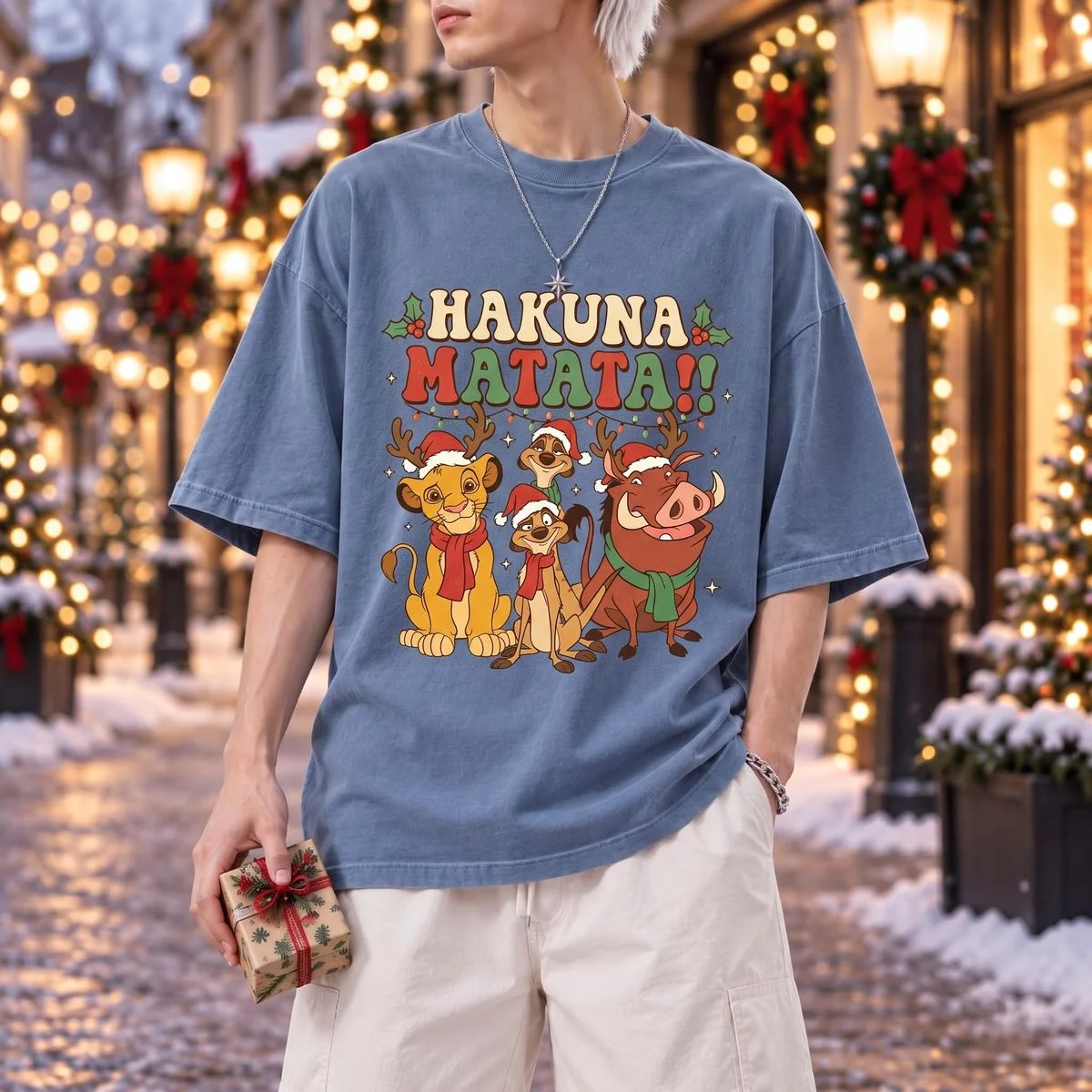 Lion King Teacher Christmas Shirt for Holiday Classroom Fun 4 Male model outdoors on festive city street wearing slate blue lion king teacher christmas shirt with retro cartoon Simba and Timon art