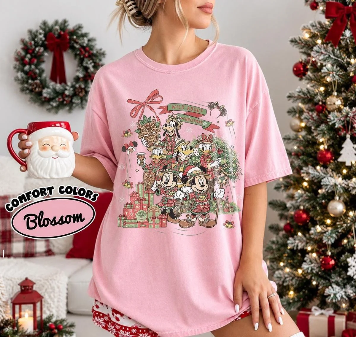 Vintage Wild About Christmas Safari Shirt Iconic Plaid Squad, Comfort Colors Disney Holiday Shirt 10 plaid safari gang tee in Comfort Colors blossom pink worn by woman holding Santa mug