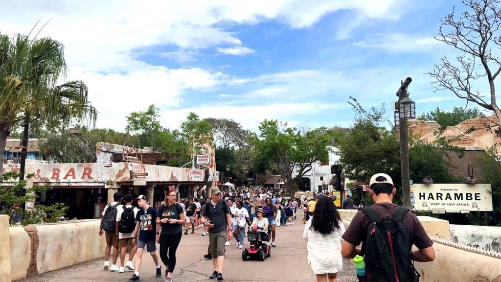Christmas at Animal Kingdom Secrets Every Traveler Needs for 2027 28 The Welcome to Harambe sign and daytime crowds walking toward Dawa Bar and Tusker House in Africa
