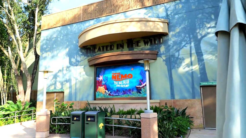 Christmas at Animal Kingdom Secrets Every Traveler Needs for 2027 16 The exterior entrance and marquee of Theater in the Wild featuring the Finding Nemo The Big Blue and Beyond poster at Animal Kingdom
