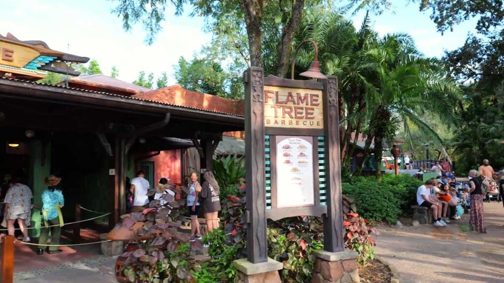 Christmas at Animal Kingdom Secrets Every Traveler Needs for 2027 31 The wooden outdoor sign and ordering counters at Flame Tree Barbecue on Discovery Island in Animal Kingdom